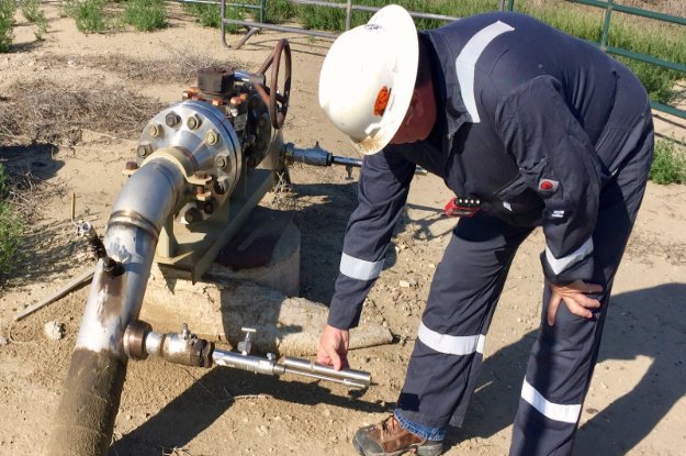 man-working-corrosion-mitigation man working on pipeline